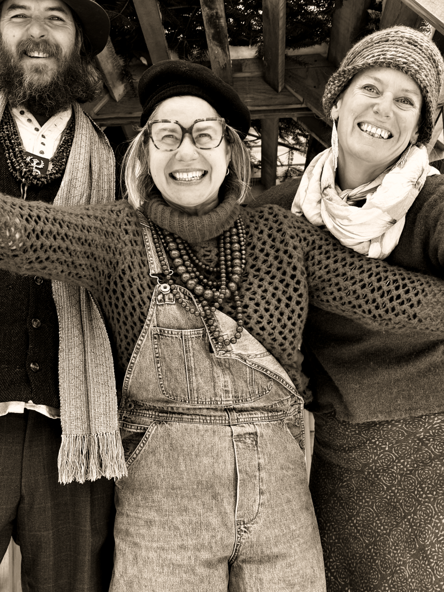 Three friends laughing in the snow