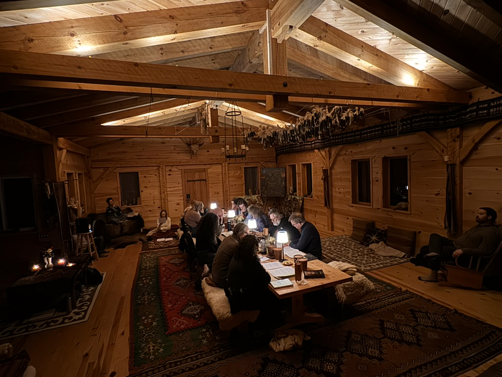 Gathering by candlelight inside the Orphan Wisdom Hall